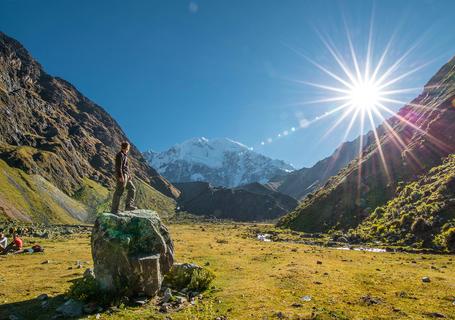 4 Salkantay Trek - Tourist over a rock on Salkantay Path