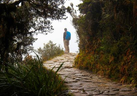 6 Classic Inca Trail - A person on the Inca path with clouds
