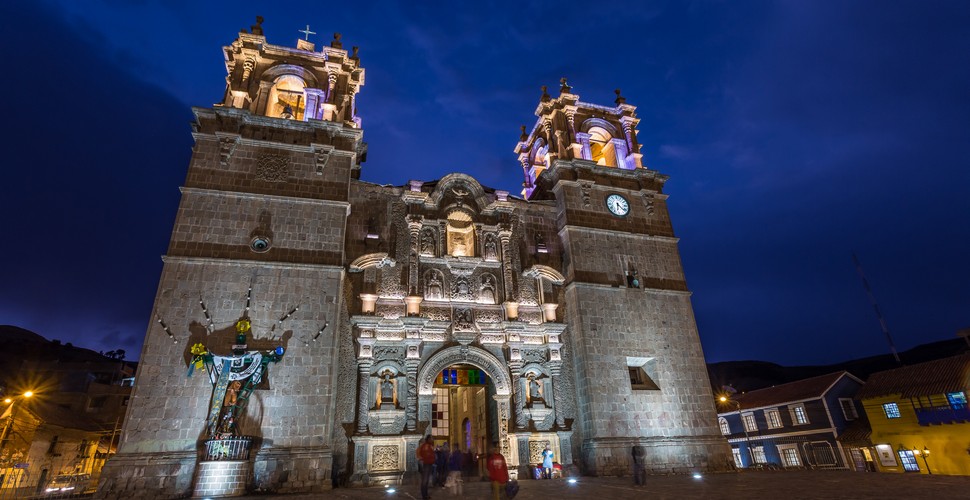 Back on the mainland, you will find the Puno main square with a pretty cathedral, left by the Conquistadores. The stunning cathedral was built in 1757 and features two bell towers, a carved facade, and two large green doors. Mak sure you visit on your Peru vacation packages!