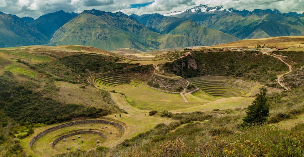 Discover Moray, the enigmatic circular Inca site on a Sacred Valley tour from Cusco. There are 3 descending crevices that plunge into the hillside, each with 12 levels of terraces. Surrounded by the magnificent Andes mountains, staring into the depths of these man-made craters will fill you with magic and awe.