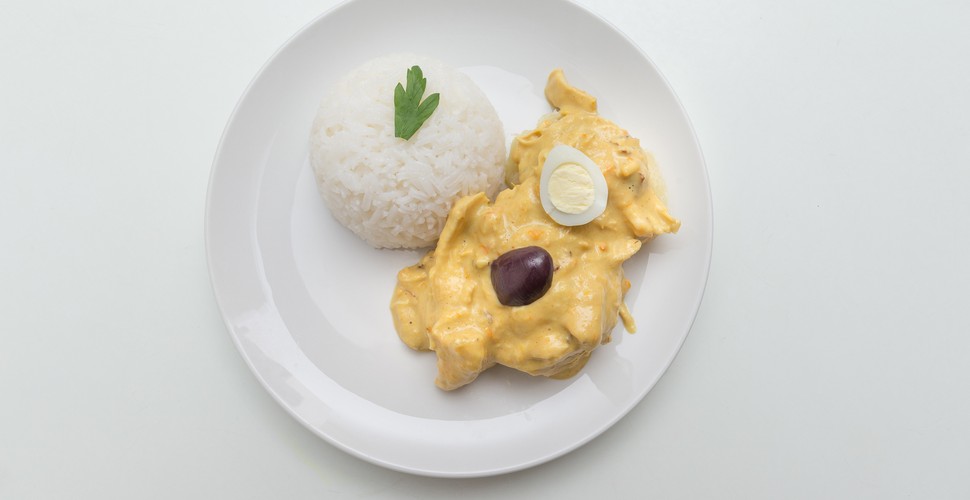 Often consumed on cold days by many Peruvians, aji de gallina is a médium spicy dish of shredded chicken in a creamy sauce. It is served with rice and garnished with black olives and a boiled potato. The sauce is made with aji amarillo, garlic, onions, Brazil nuts, cheese, and breadcrumbs, and it is often flavored with cumin, pepper, oregano, turmeric, and parsley. Make sure you sample it when you visit Peru.