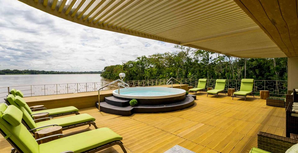 During the breaks between jungle excursions, passengers can hang out near the plunge pool or head indoors to the air-conditioned Canopy Lounge. The bartenders shake up pisco sours with incredible speed and deliver them to whichever comfy couch or chair you've occupied on your Iquitos river cruise. 
