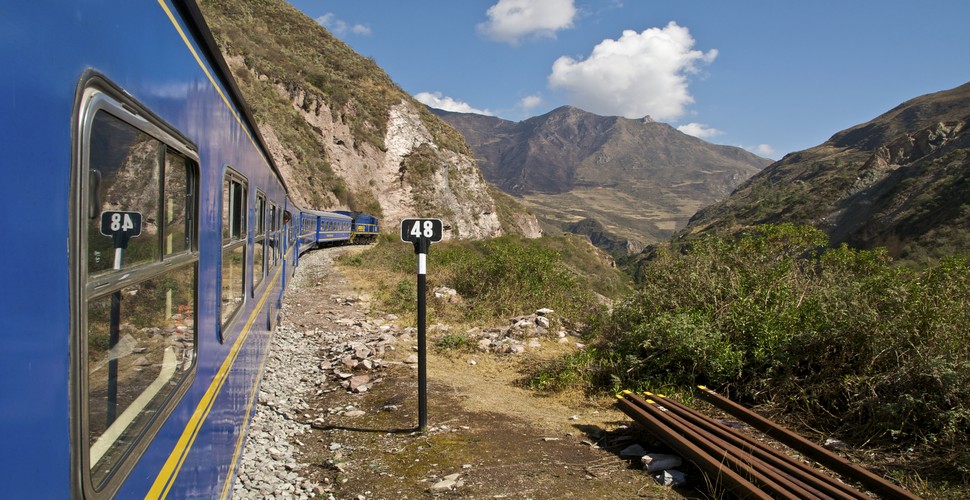 The Expedition Train Service is the tourist class option to get to Aguas Calientes on your Machu Picchu vacation package. The service has wider windows on the sides for panoramic views of the stunning Sacred Valley. It has comfortable seats and stable tables in front of the seats. The Expedition service has more departures and schedule availability than other train services and departs from  Cusco, Poroy station, and Ollantaytambo station.