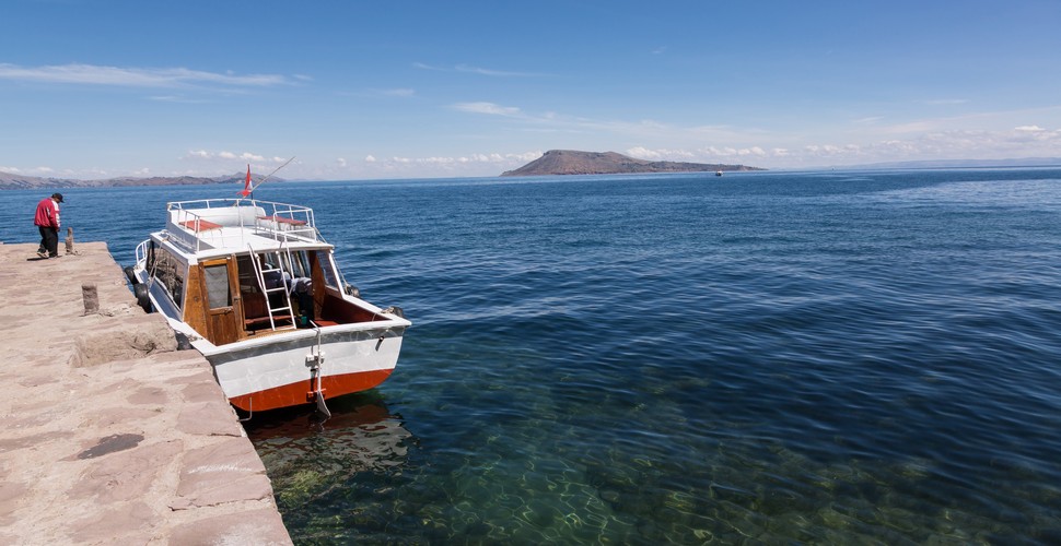 Lake Titicaca, located on the border of Peru and Bolivia, is the largest lake in South America by volume. The lake's azure waters against the backdrop of the Andean mountains create a mesmerizing sight to see on your Per tour packages.