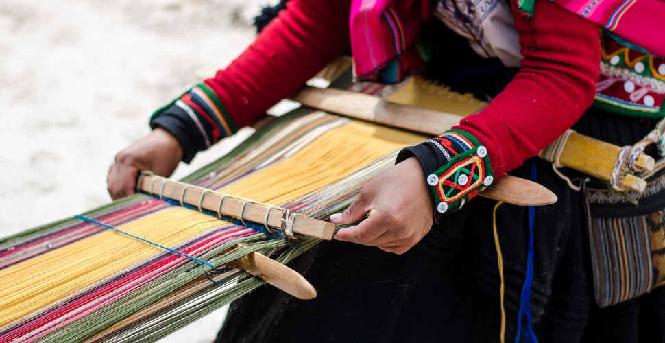 Visitors to Chinchero on Cusco Peru tours can observe the weavers in action. The process begins with spinning and dyeing the wool to create intricate patterns on traditional looms. Purchasing directly from the artisans supports the local economy and helps preserve these ancient traditions.