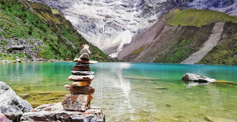 Humantay Lake is a stunning turquoise lake located near the base of the Humantay Glacier, in the Vilcabamba mountain range. You can visit on a day trip or as part of the Salkantay trek to Machu Picchu!