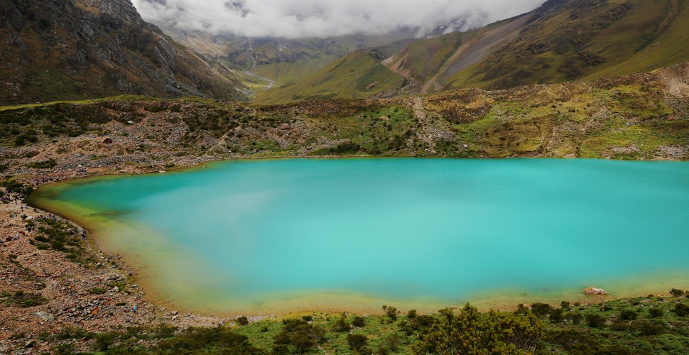 Humantay Lake is considered sacred by the local Quechua people. The local people have a deep spiritual connection to the land. It is common to see offerings such as coca leaves and other items left at the lake as part of traditional rituals and ceremonies when you travel to Cusco Peru.