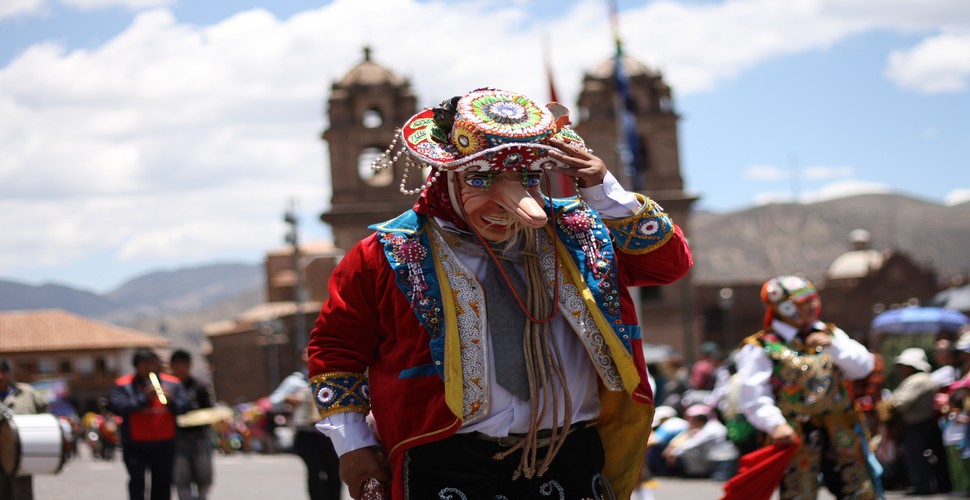 Traditional masks are often worn at a Peruvian festival. They are used as part of the costumes to represent specific characters or themes. These masks can vary widely in style and design, depending on the cultural or historical context they are meant to portray. 