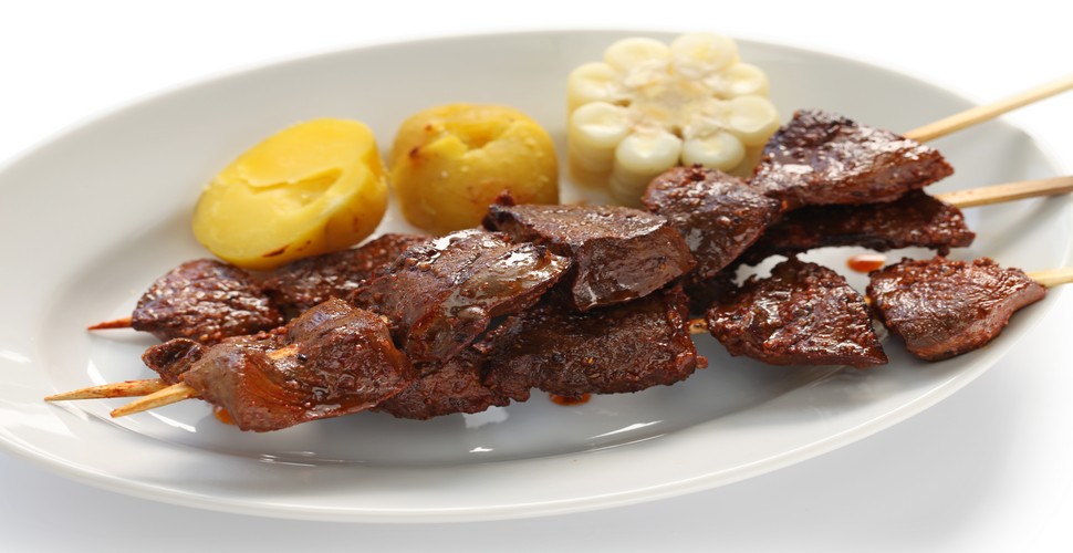 "Anticuchos " are popular during Fiestas Patrias celebrations in Peru. They can be sampled on street food stalls, in markets, and at restaurants on your Peru tour packages, especially during festive occasions. Anticuchos are made from beef hearts generally, however, you can find chicken and vegetarian versions too!