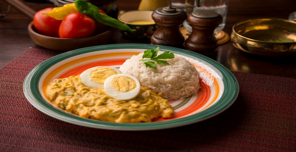 In the restaurants of Peru, there's a dish that warms the soul and delights the senses with its rich flavors and creamy sauce. Aji de gallina is a staple dish and a firm favorite with travelers on their Peru tour packages and local people alike.