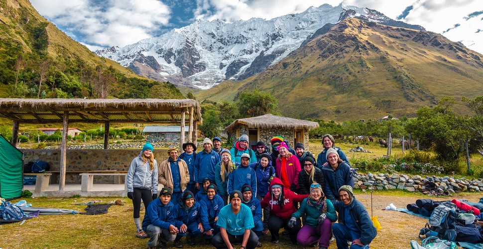 The Valencia Travel Muleteers and cooks with trekkers on The Salkantay trek