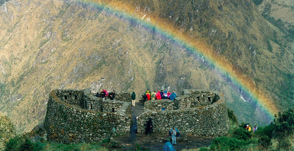 Rainbow over a temple on a Machu Picchu tour.