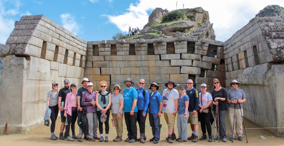 Our Incredible Knowledgable Machu Picchu Tour Guide and Group in a Machu Picchu Temple