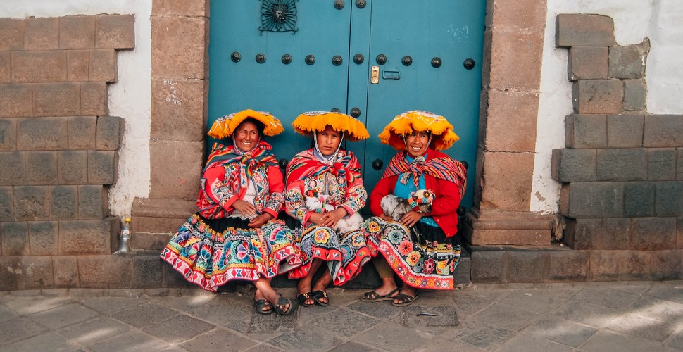 three women in traditional dress in Cusco